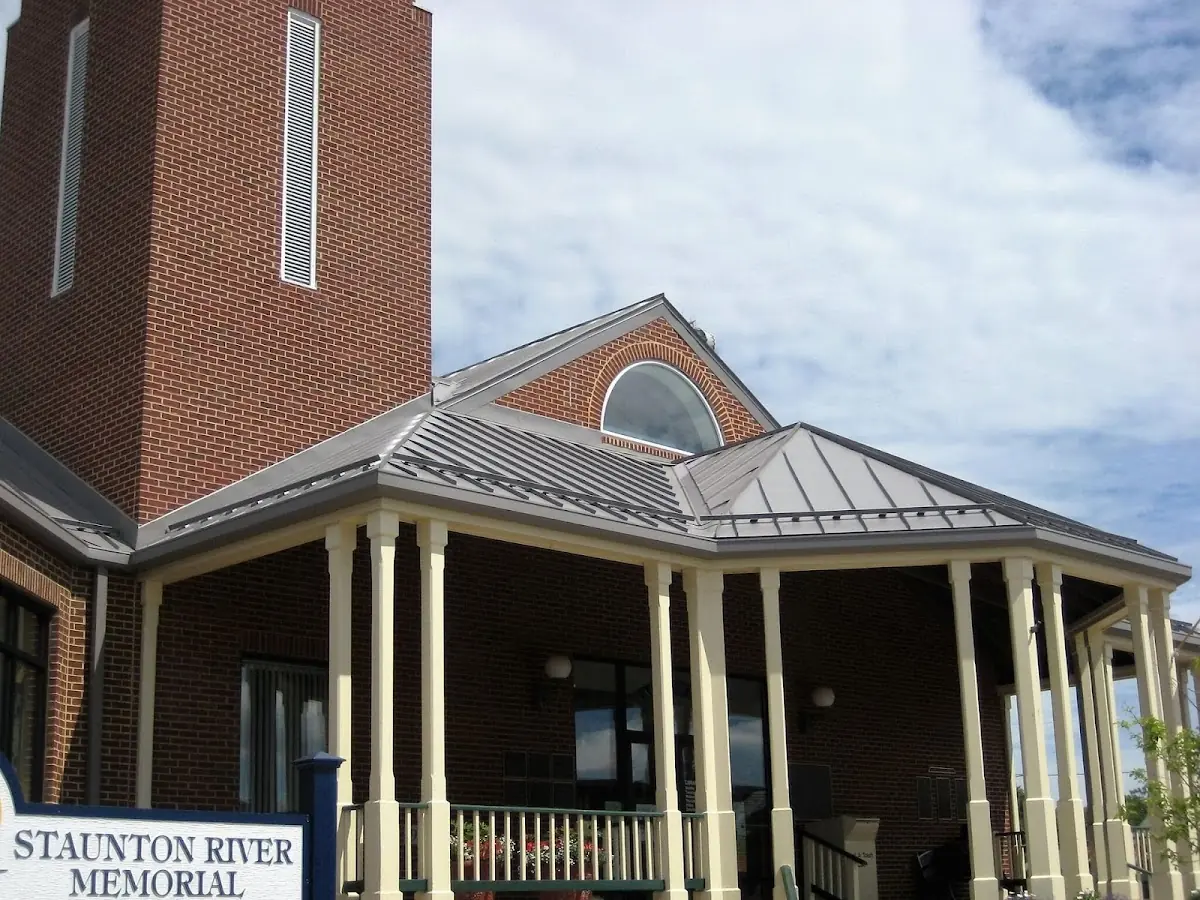 Skilled roofing craftsmen working on a residential roof in Madisonville